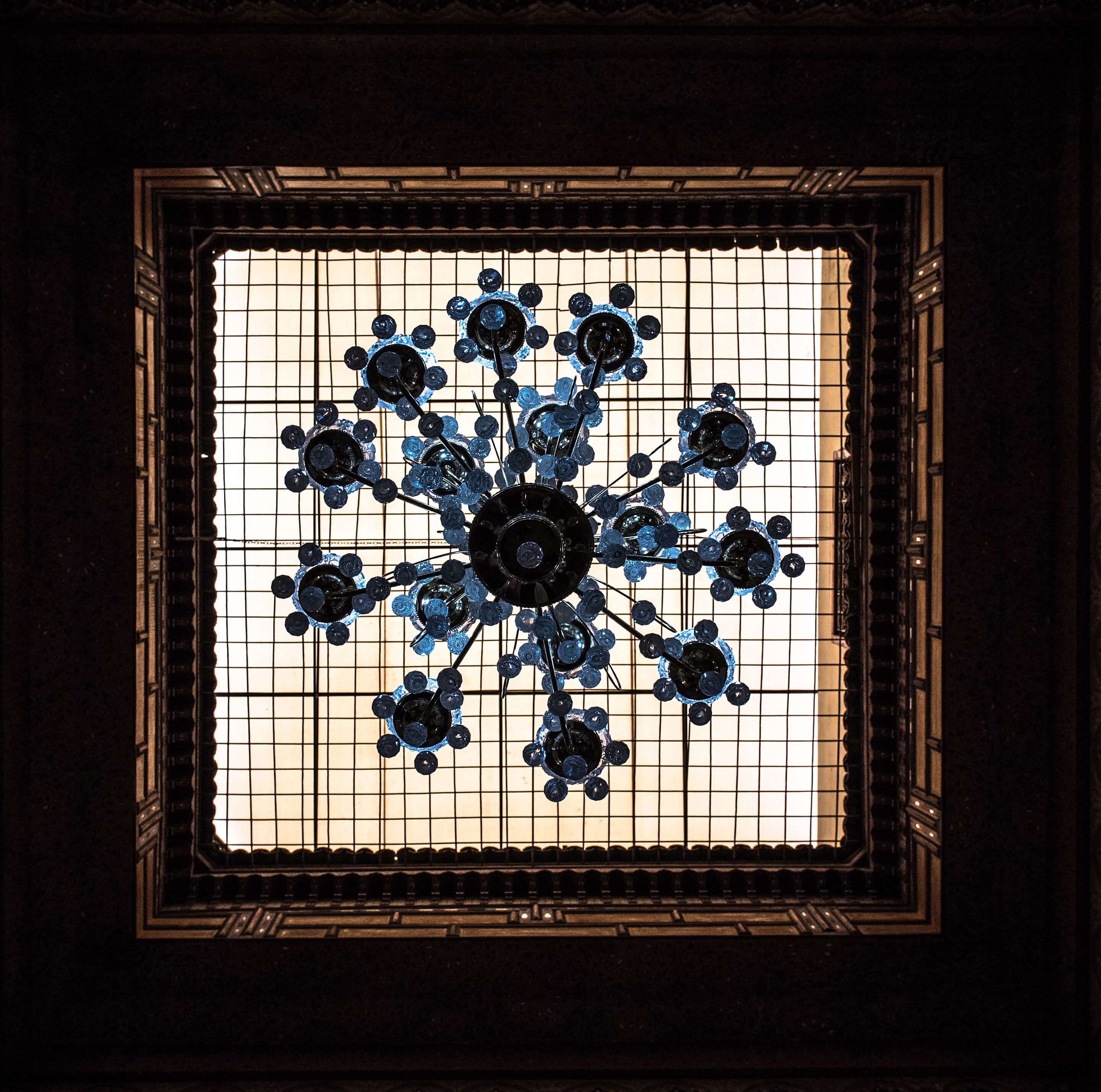 A stained glass window with a geometric design.
