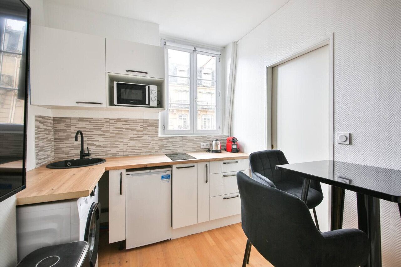 Microwave, coffee/tea maker, cookware/dishes/utensils, dining tables