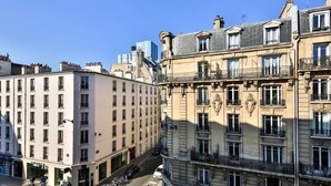 A multi-story building with a classic architectural style, featuring balconies and large windows. - 41.Studio 2Pers#Sèvres-Lecourbe#Necker (Paris)