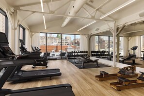 A gym with treadmills, weight machines, and a rowing machine. - Eurostars Old Montreal Suites & Apartments (Montreal)