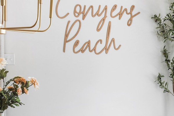 Custom made Conyers' Peach sign in dining room.