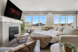 Smart TV, fireplace, books, offices