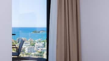 Deluxe Family Room, Balcony, Sea View | Minibar, in-room safe, desk, blackout drapes