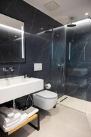 Deluxe Family Room, Balcony, Sea View | Minibar, in-room safe, desk, blackout drapes