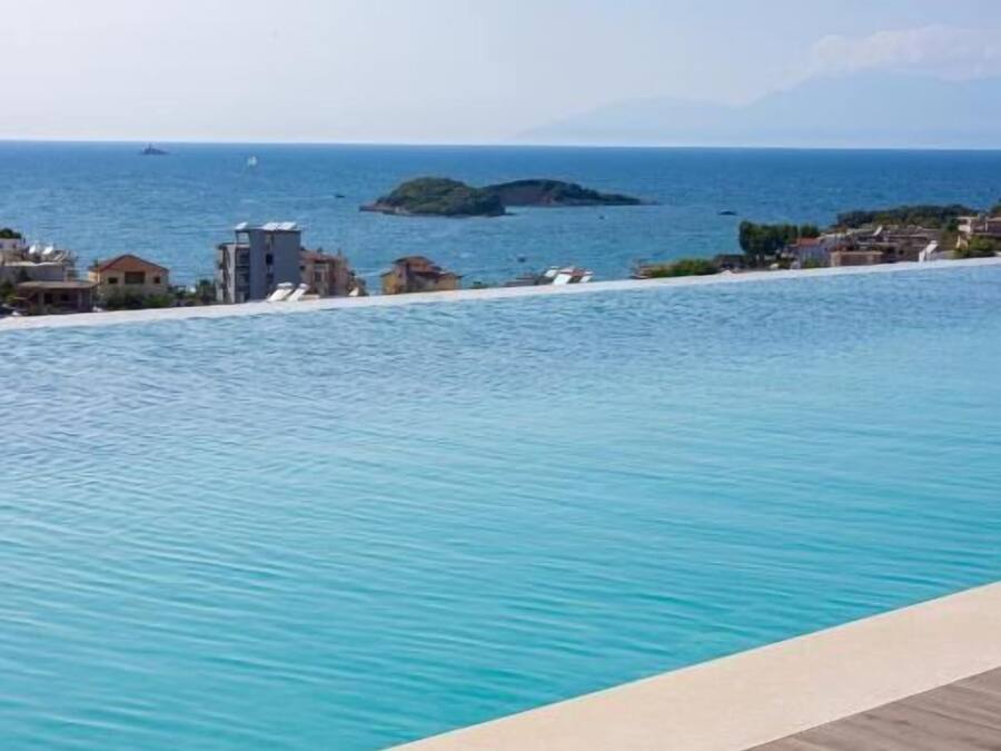 Seasonal outdoor pool, pool umbrellas, pool loungers