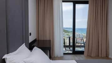 Deluxe Double Room, Balcony, Sea View | Minibar, in-room safe, desk, blackout drapes