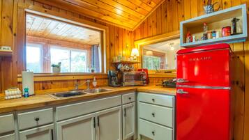 Fridge, coffee/tea maker, toaster, cookware/dishes/utensils
