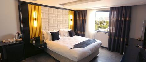 Ropa de cama de alta calidad y minibar