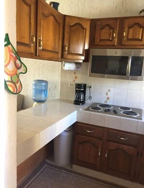 Fridge, microwave, stovetop, coffee/tea maker