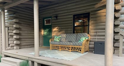 Modern Log Cabin in woods with two gas fireplaces; 20 acres; great location.