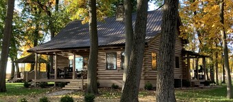 Modern Log Cabin in woods with two gas fireplaces; 20 acres; great location.