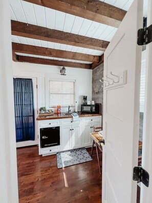 Fridge, coffee/tea maker, cookware/dishes/utensils