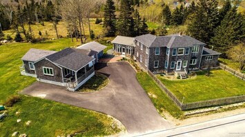 Sky view.  Guest cottage on the left, sunroom and main house on the right.