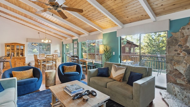 A spacious living area with a high ceiling, wooden beams, and a stone fireplace. - "Modern" Zephyr, 3 mins to beach, 7 mins to Heavenly, Casinos (Zephyr Cove)