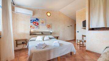 2 slaapkamers, een strijkplank/strijkijzer, beddengoed