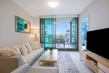 Kick back in the living room on the cosy lounge with throw pillows and a blanket or in the armchair, perfect for unfurling with a good book or getting stuck into a show on the HD TV.