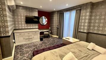 1 bedroom, desk, iron/ironing board, travel crib