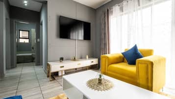 Apartamento | Área de estar | TV
