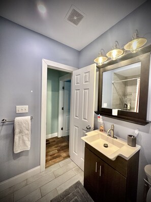 Shower, hair dryer, towels, soap