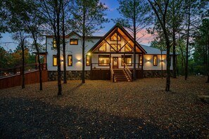 Exterior - Magical 3-bed cabin with pool table & hot tub. Greet the day with wooded mountain views, relax by the firepit, then unwind in the bubbling spa. (Broken Bow)
