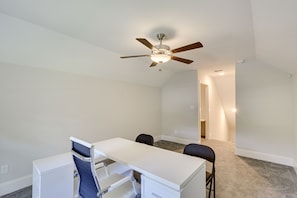 A room with a white desk, two chairs, a ceiling fan, and a carpeted floor. - Family-friendly Crawfordville Home ~ 15 Mi to Fsu! (Crawfordville)