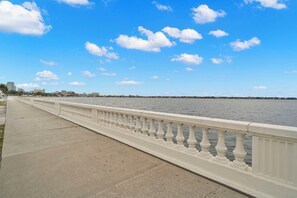 Stroll along the waterfront promenade with a scenic view of the adjacent body of water.