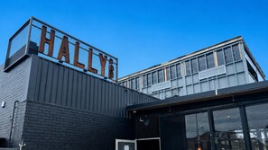 A modern building with a prominent sign reading 'HALYS'.