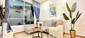 Family Apartment, 5 Bedrooms, Accessible, City View | Living area | 48-inch Smart TV with cable channels, video-game console, Netflix - The Wave Residence (Malacca City)