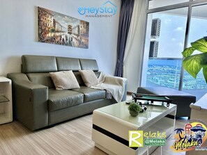 Premium Apartment, 2 Bedrooms, Non Smoking, City View | Living area | 48-inch Smart TV with cable channels, video-game console, Netflix - The Wave Residence (Malacca City)