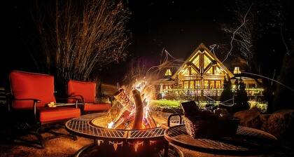 Luxurious log cabin with river views, hot tub, firepit, outdoor areas, & W/D