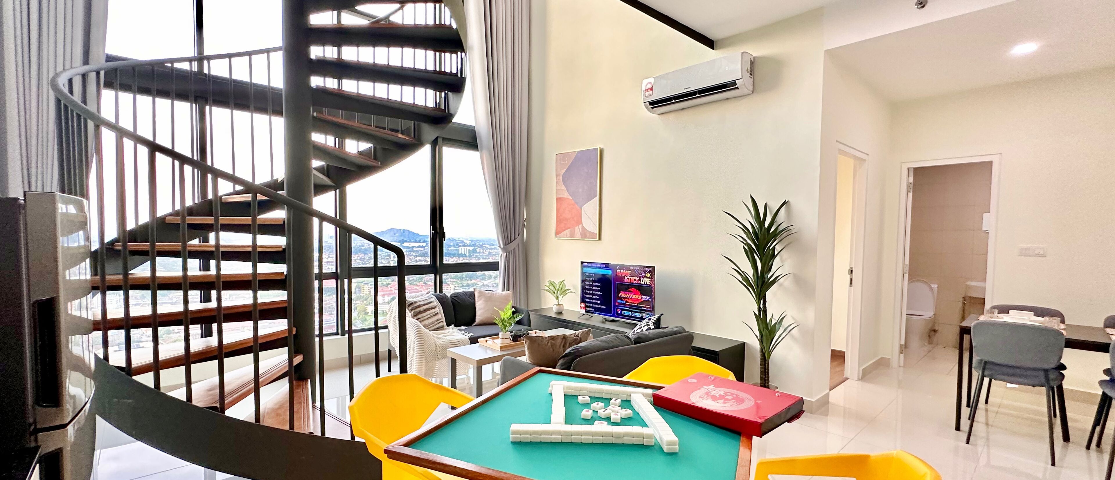 A modern living room with a spiral staircase, a pool table, and a dining area.