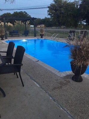 Outdoor pool, open 9:00 AM to 10:00 PM, pool loungers