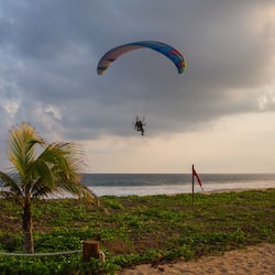 On the beach, white sand, sun-loungers, beach umbrellas