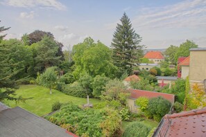 Escape to a serene garden oasis with a tranquil fountain and beautifully maintained grounds.