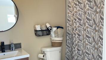 Hair dryer, towels, soap, shampoo
