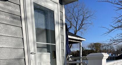 Cozy riverfront cottage with an easy beach-inspired coastal MI vibe!