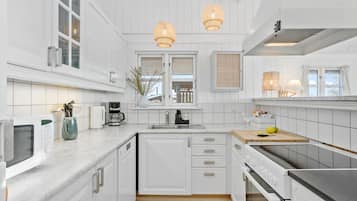 Fridge, stovetop, dishwasher, coffee/tea maker