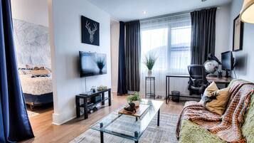 1 bedroom, desk, iron/ironing board, travel crib