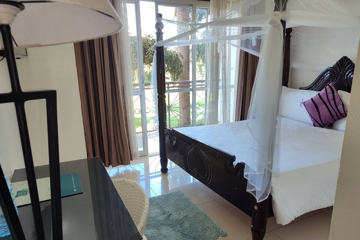 Premium bedding, desk, laptop workspace, free WiFi