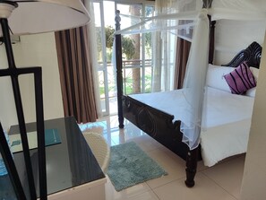 Premium bedding, desk, laptop workspace, free WiFi