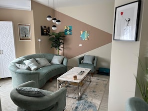 Apartamento, 1 cama Queen | Área de estar