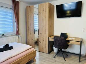 4 bedrooms, desk, iron/ironing board, travel cot