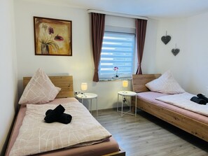 4 bedrooms, desk, iron/ironing board, travel cot