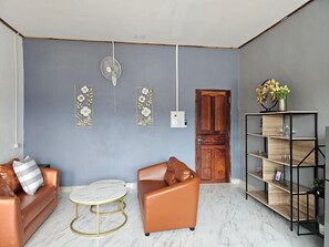 Suite empresarial | Área de sala de estar