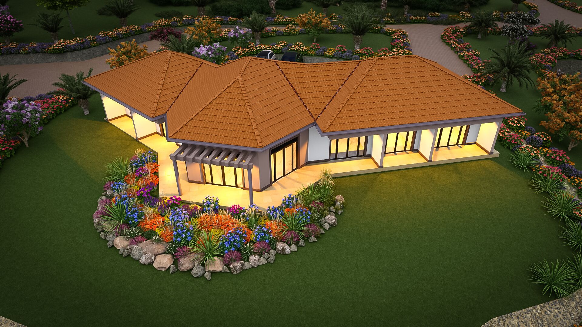 A two-story house with a tiled roof, large windows, and a landscaped garden with colorful flowers and palm trees.