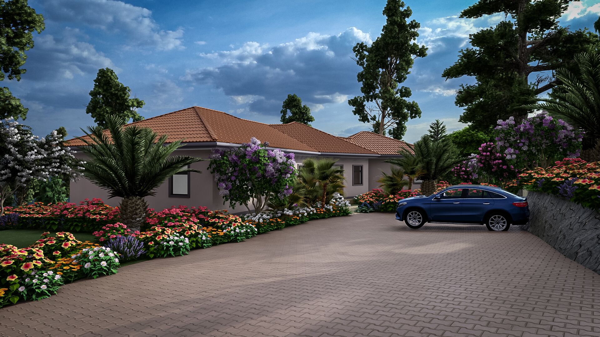 A house with a paved driveway, surrounded by a variety of flowering plants and trees.