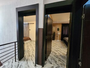 65-inch Smart TV with satellite channels, DVD player - The Milton Apartment (Lagos)