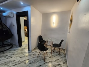 65-inch Smart TV with satellite channels, DVD player - The Milton Apartment (Lagos)