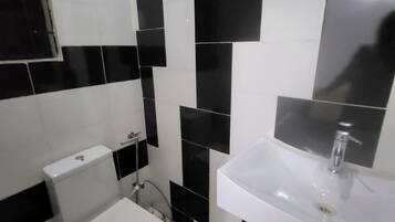 Shower, rainfall showerhead, bidet, towels