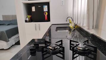 Fridge, microwave, stovetop, cookware/dishes/utensils